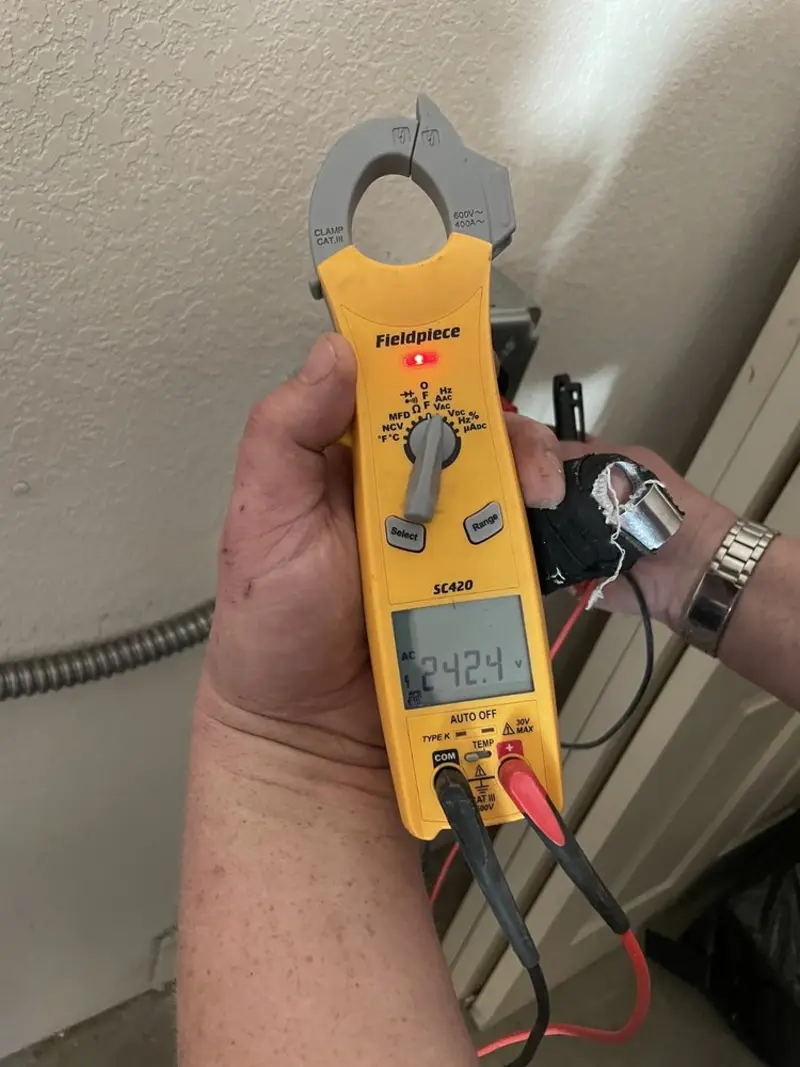 Voltage testing with clamp meter during Circuit Breaker Repair in Lewisville